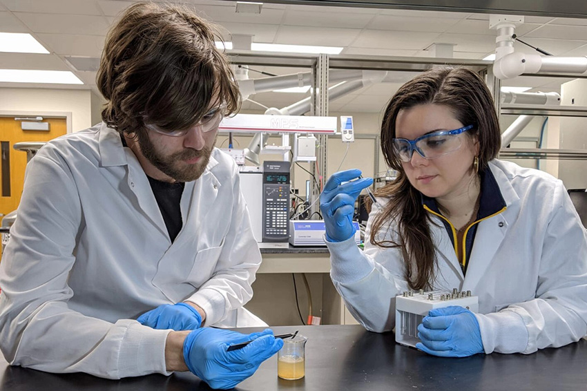 Emanuela Gionfriddo, Ph.D., and Ronald Emmons, Ph.D. candidate, studying water quality
